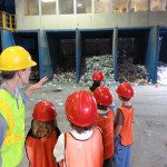 adult showing children debris from a construction site