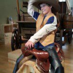 cowboy riding a make-believe horse