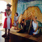 cropped children in costume playing violins 2
