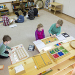 children playing with wooden block puzzles