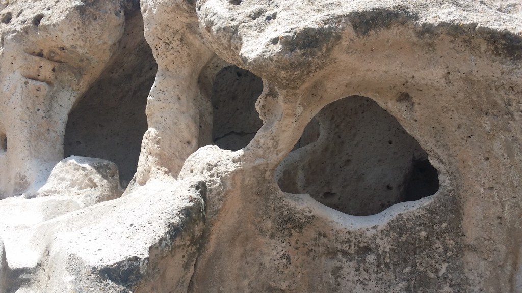 large rock formation with holes